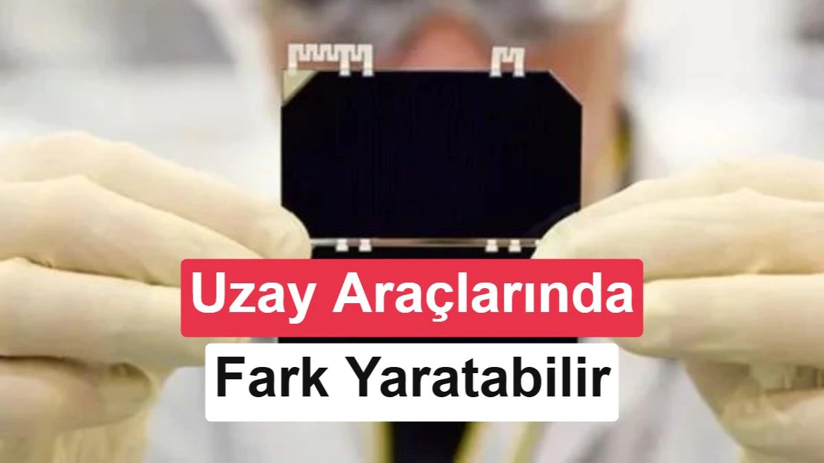 Bir elin tuttuğu, üzerinde koyu renkli hücre bölümleri bulunan küçük güneş paneli