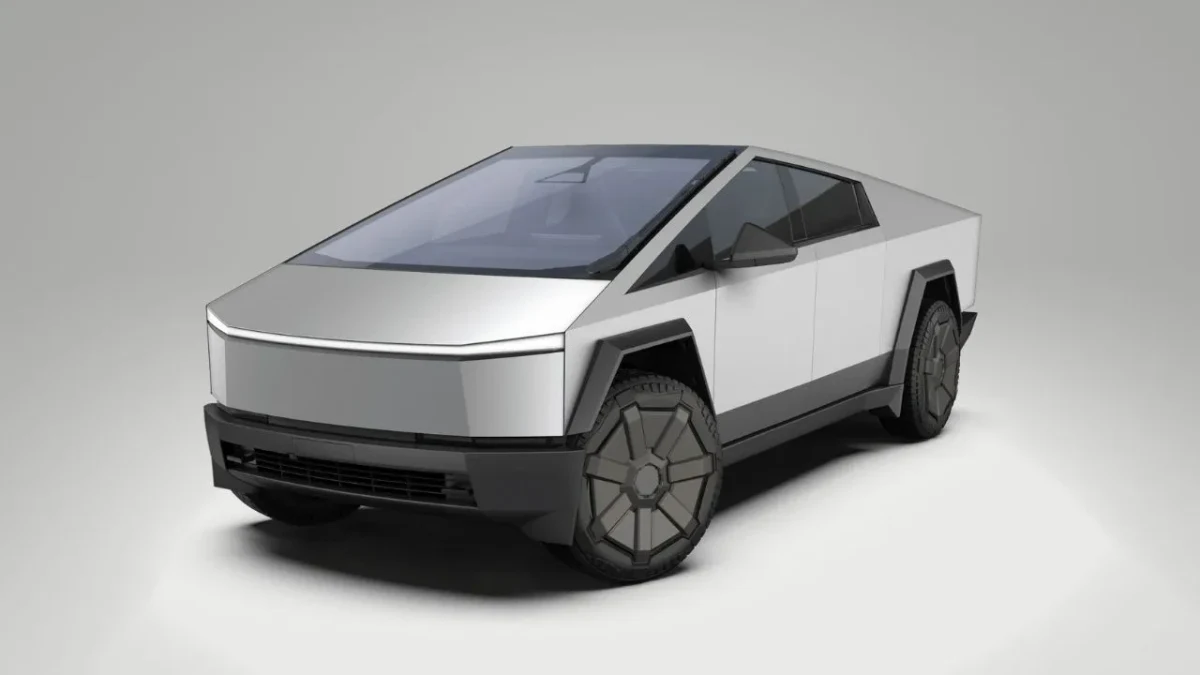Gri fonda önden ve yandan görünen Tesla Cybertruck