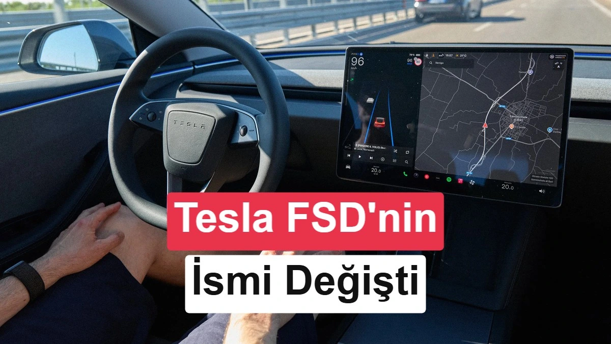 Tesla otomobilinin içinden görünen direksiyon ve orta ekrandaki sürüş arayüzü