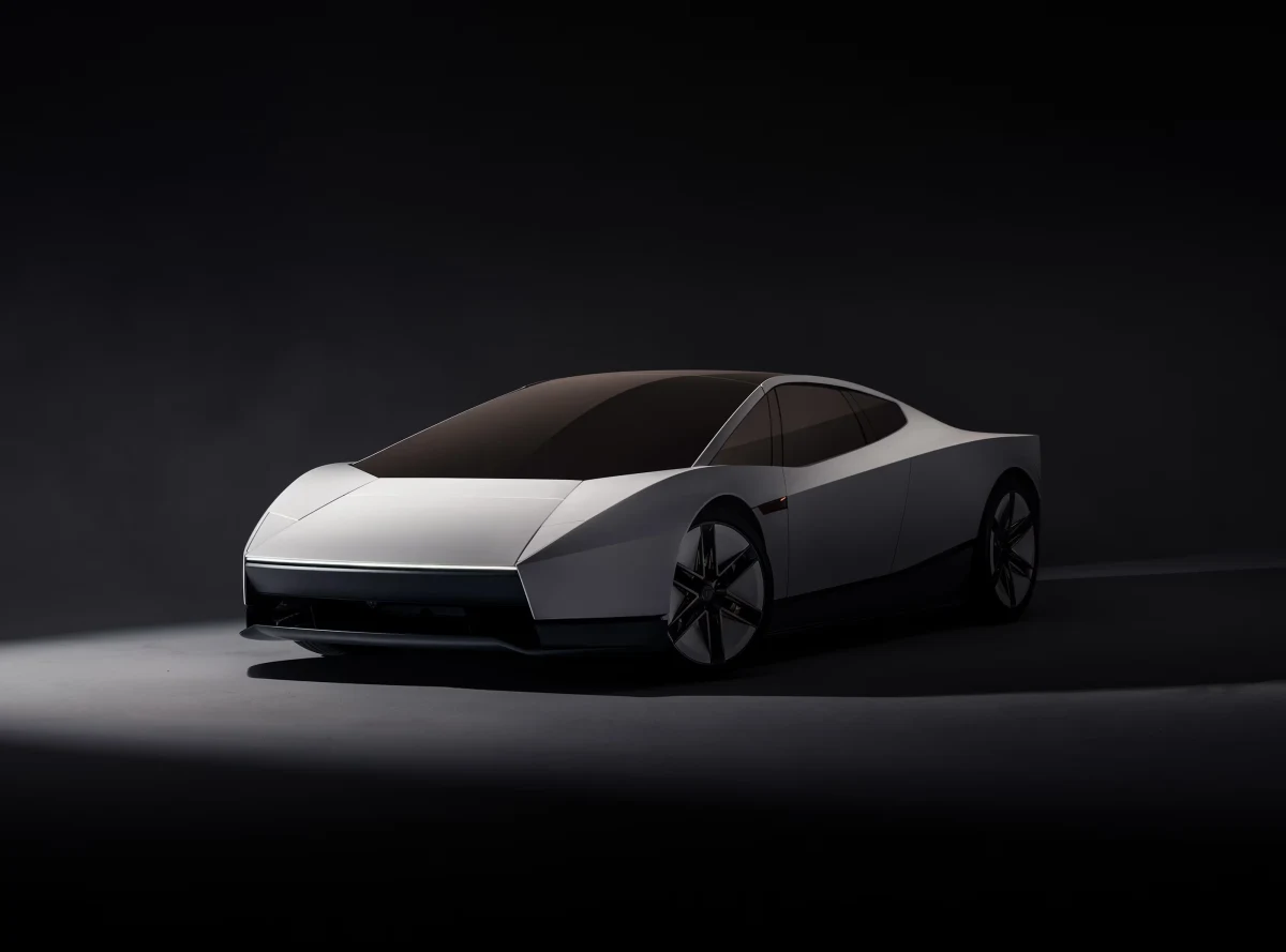 Koyu fonda önden ve yandan görünen beyaz Tesla Roadster